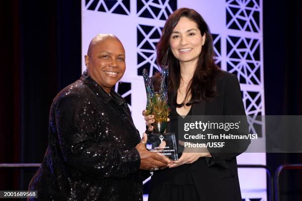 Kim Crabbe presents Esmerelda Nergon with the Kim Crabbe Game Changers Award at the U.S. Soccer Awards Dinner Reception during the U.S. Soccer Annual...