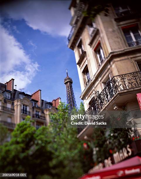 france, paris, buildings and eiffel tower, low angle view - eiffel tower cafe stock pictures, royalty-free photos & images