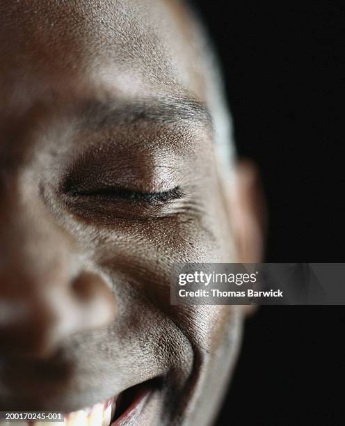 man smiling, eyes closed, close-up - eyes closed smile stock pictures, royalty-free photos & images