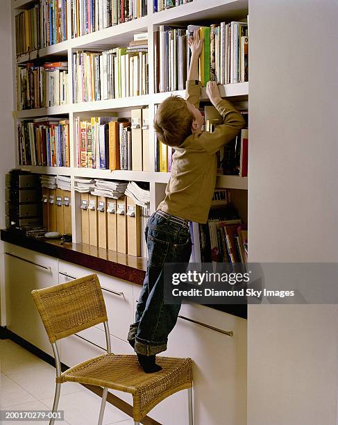 Reaching Books 168 Boy Reaching For Book Stock Photos, High-Res Pictures, and Images ...