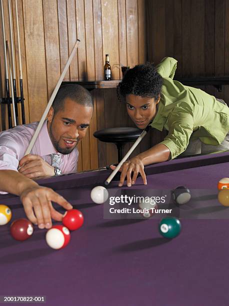 man assisting woman play pool - game room 個照片及圖片檔