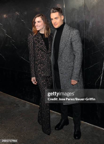 Allison Williams and Alexander Dreymon are seen at the Michael Kors Fashion Show on February 13, 2024 in New York City.