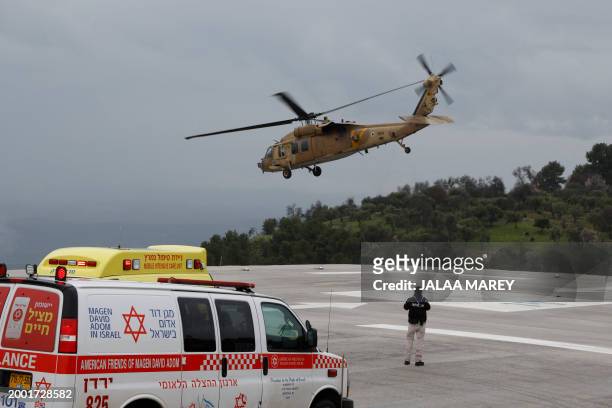 Graphic content / A militrary helicopter transports from Ziv hospital in Israel's northern city of Safed a person wounded in a rocket attack fired...