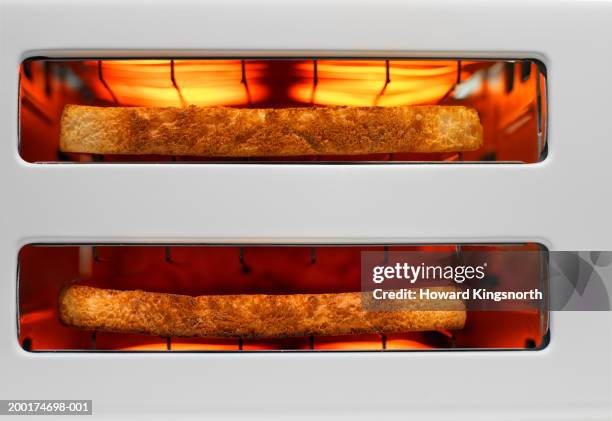 toast in toaster, overhead view, close-up - toaster stockfoto's en -beelden