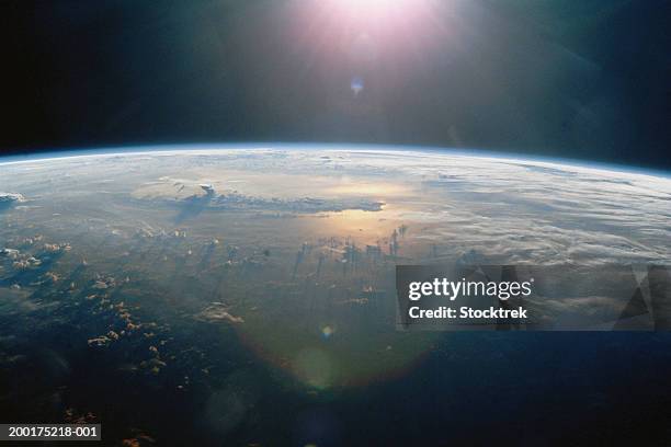 thunderclouds over pacific ocean at sunset, view from satellite - pacific stock-fotos und bilder