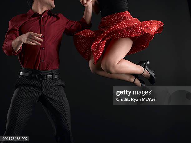 couple swing dancing, low section - jive dancing stock pictures, royalty-free photos & images