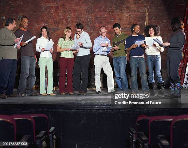 group of people on stage in theater - audition stockfoto's en -beelden