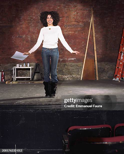 woman on stage in theater, smiling - audition ストックフォトと画像