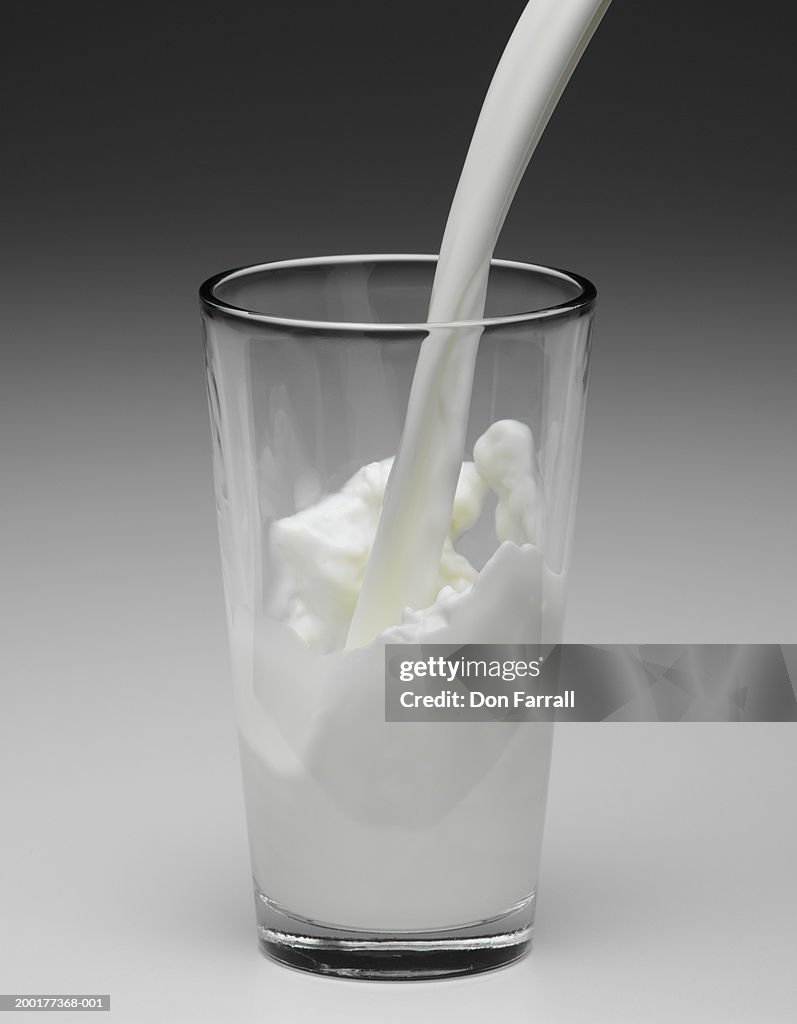 Milk being poured into glass