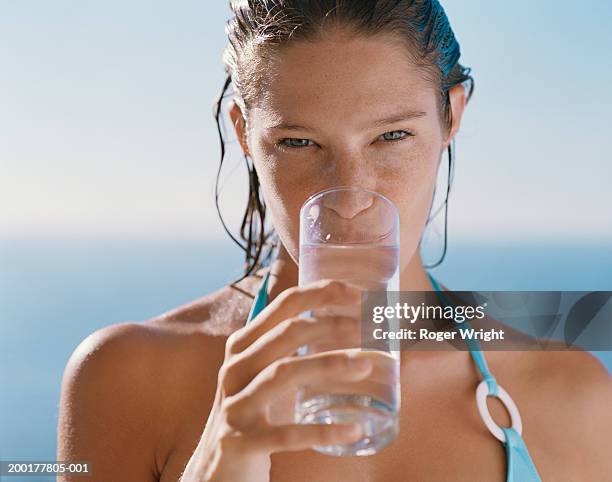 young woman drinking glass of water, portrait - wet hair stock pictures, royalty-free photos & images
