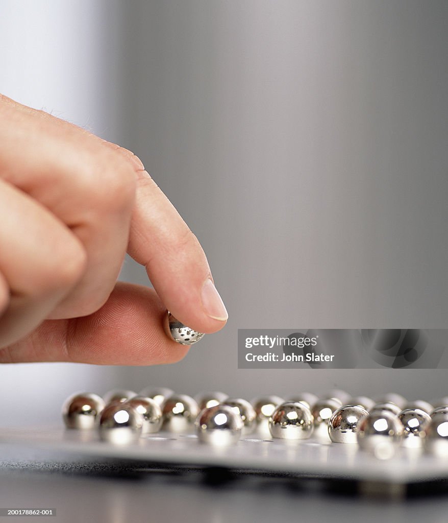 Man playing solitaire, close-up