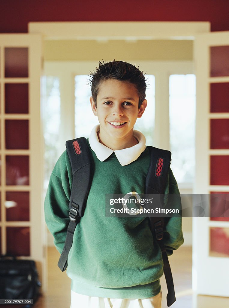 Boy (10-12) wearing school uniform, portrait