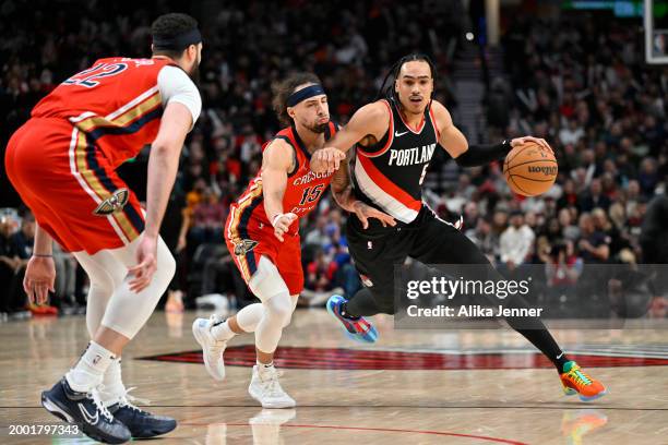 Dalano Banton of the Portland Trail Blazers dribbles against Jose Alvarado of the New Orleans Pelicans during the third quarter of the game at the...