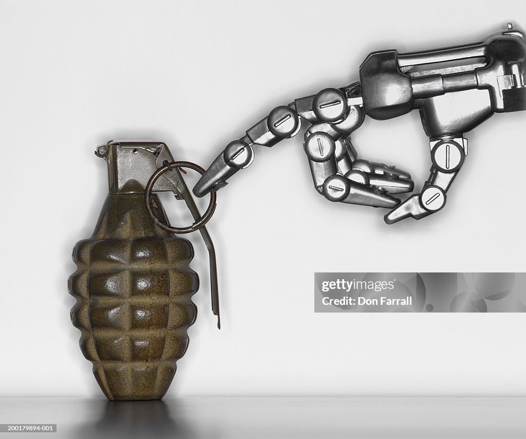 Robot's hand touching grenade, close-up