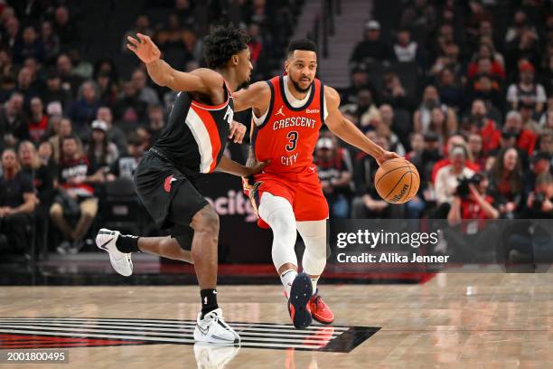 McCollum of the New Orleans Pelicans dribbles against Ashton Hagans of the Portland Trail Blazers during the second quarter of the game at the Moda...