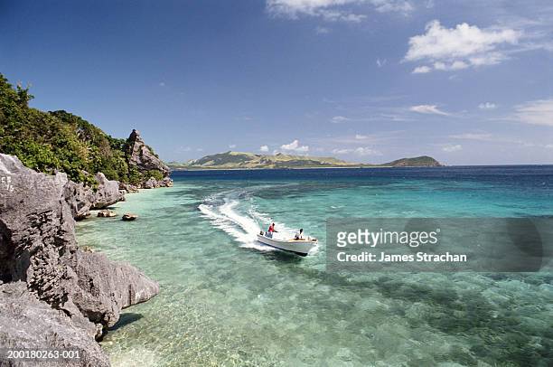 fiji, yasawa island, people in boat on ocean - fiji stock pictures, royalty-free photos & images