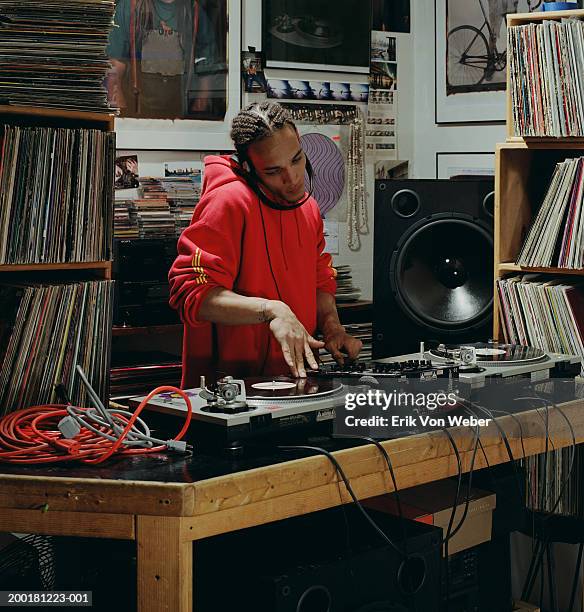 disc jockey playing record - plattenspieler stock-fotos und bilder