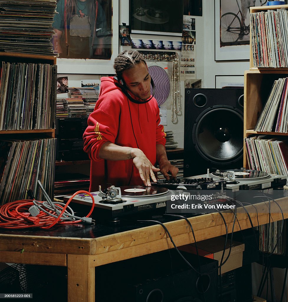 Disc jockey playing record