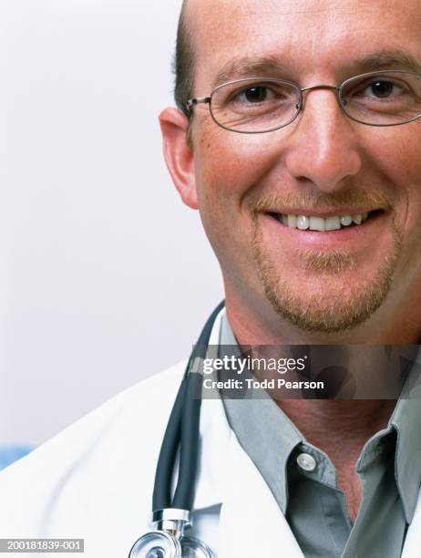 male doctor smiling, portrait, close-up - ziegenbart stock-fotos und bilder