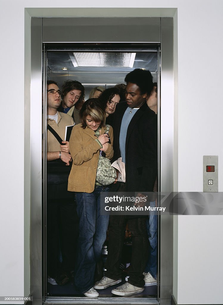 Group of people crammed into lift