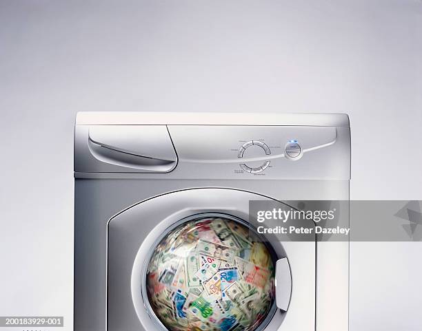 bank notes spinning in washing machine (digital composite) - washing machine front stock pictures, royalty-free photos & images