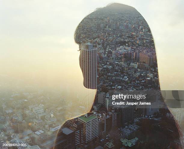 cityscape and young woman, rear view (double exposure) - mehrfachbelichtung stock-fotos und bilder