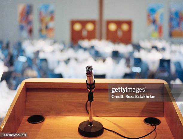 microphone on podium - rednerpult stock-fotos und bilder