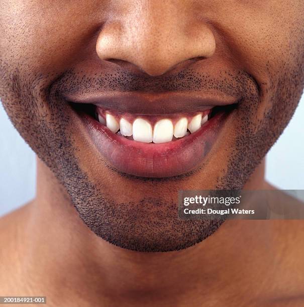 young man smiling, close-up of mouth - extreme close up mouth stock pictures, royalty-free photos & images