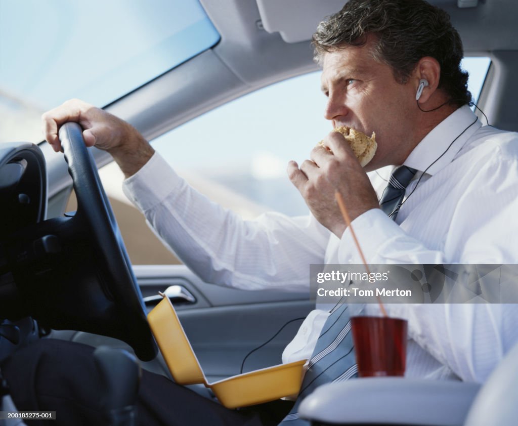 Car Eating Ruffuls Businessman Sitting In Car Eating Fast Food Closeup High-Res Stock ...