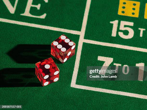 two dice on craps gaming table, close-up - クラップス ストックフォトと画像