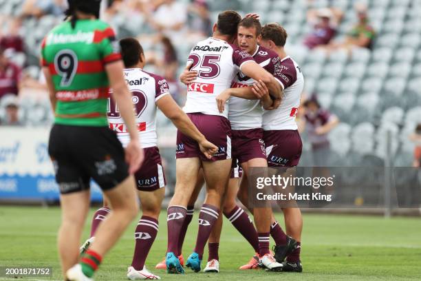 Jake Arthur of the Sea Eagles celebrates with team mates after scoring a try during the NRL pre-season trial match between Manly Sea Eagles and South...