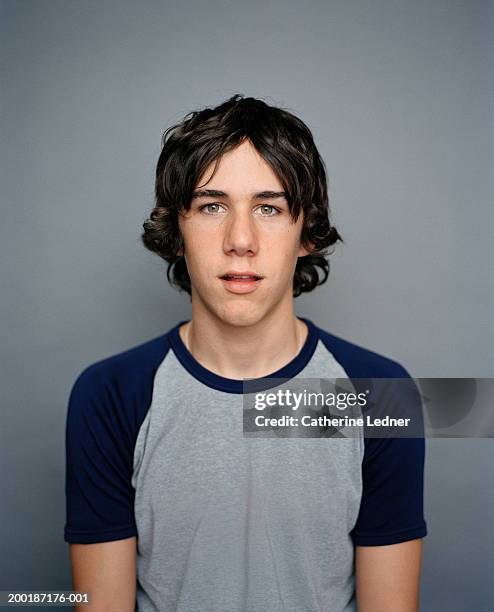 teenage boy (14-16) wearing t-shirt, portrait - teenage boys stock pictures, royalty-free photos & images