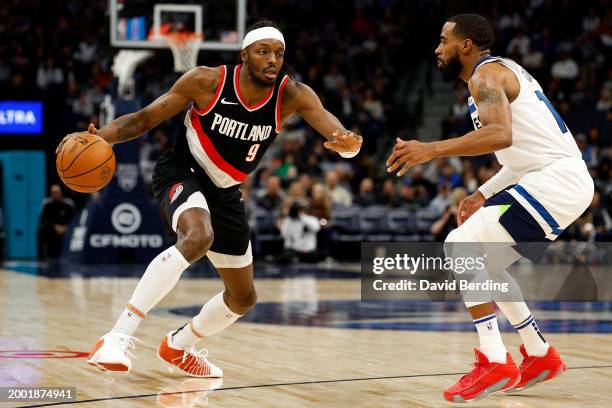 Jerami Grant of the Portland Trail Blazers drives to the basket against Mike Conley of the Minnesota Timberwolves in the third quarter at Target...