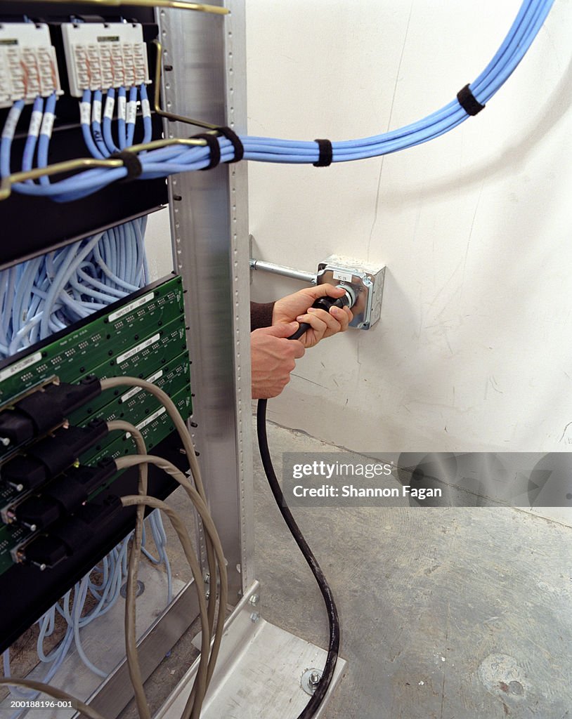 Plugging In Computer Woman Plugging In Cord In Computer Server Room Closeup Of Hand High-Res ...