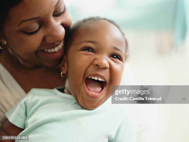 mother and daughter (1-3) smiling, close-up - baby girls fotografías e imágenes de stock