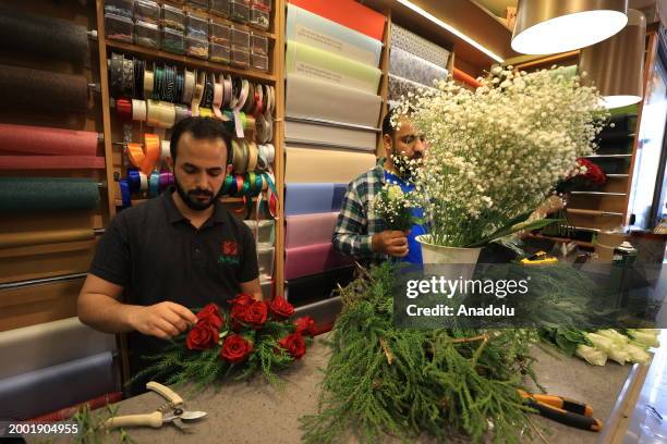 Flower shop workers prepare special flower bouquets for Valentine's Day in Baghdad of Iraq on February 14, 2024.