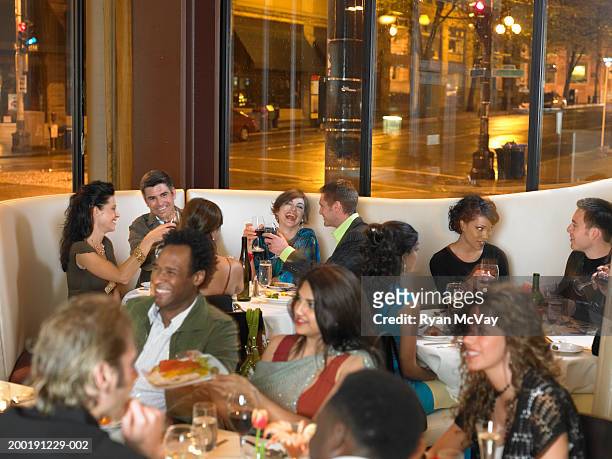 crowded restaurant, night - crowded restaurant stock pictures, royalty-free photos & images