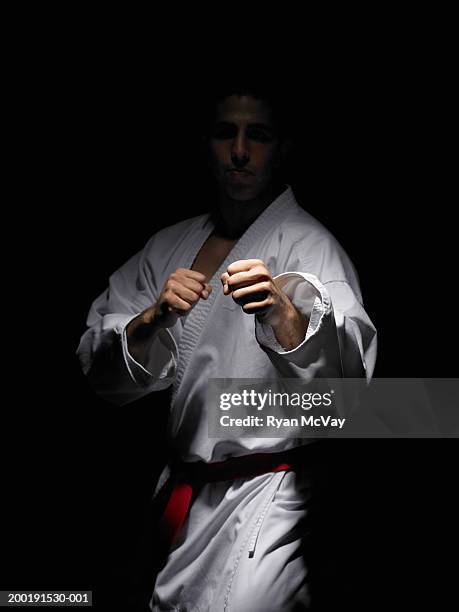 young man practicing martial arts - karate master stock pictures, royalty-free photos & images