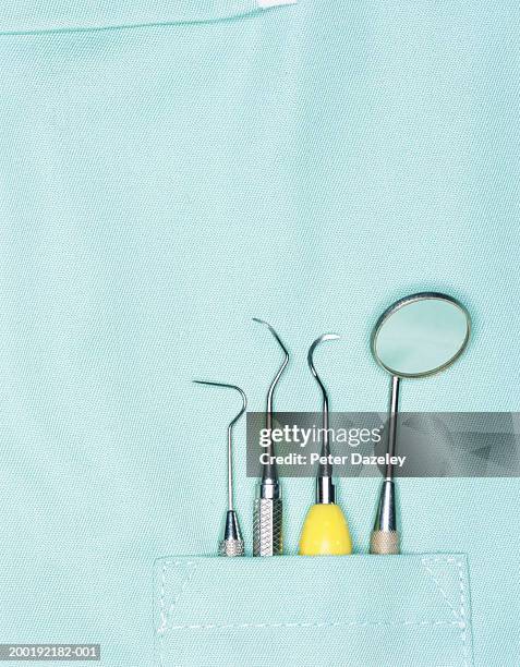 dentist's tools in pocket, close-up - dentist phobia stock-fotos und bilder