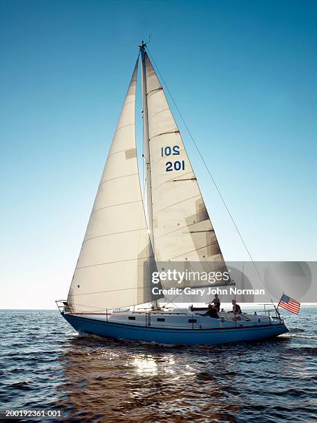 people on sailboat, side view - sailing ship stock pictures, royalty-free photos & images