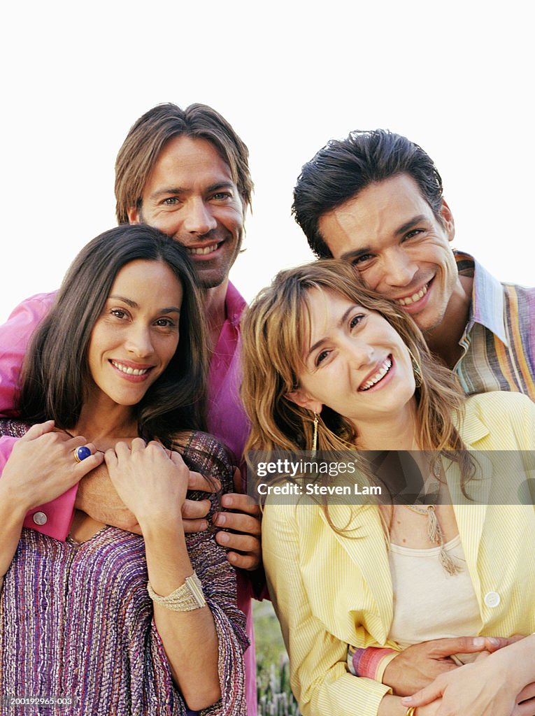 Two couples smiling, portrait