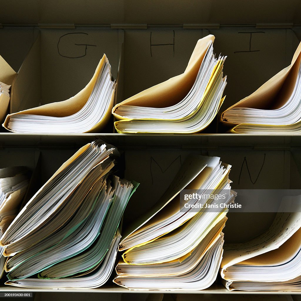 Stacks of files on shelves