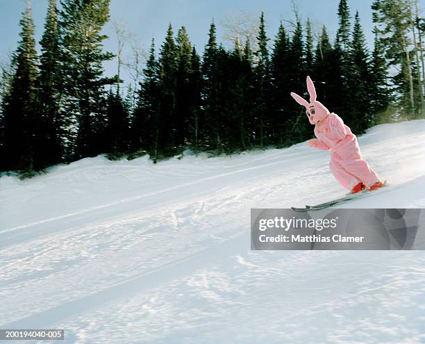 person wearing pink bunny costume skiing - park city ski stock pictures, royalty-free photos & images