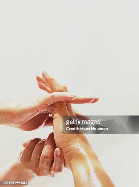 woman massaging man's foot, close-up - apothecary bottle stock pictures, royalty-free photos & images