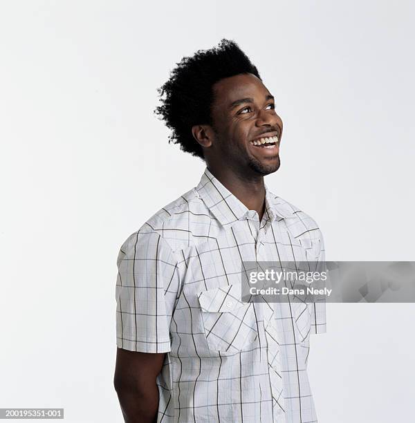 young man smiling, looking away - portrait white background looking away stockfoto's en -beelden