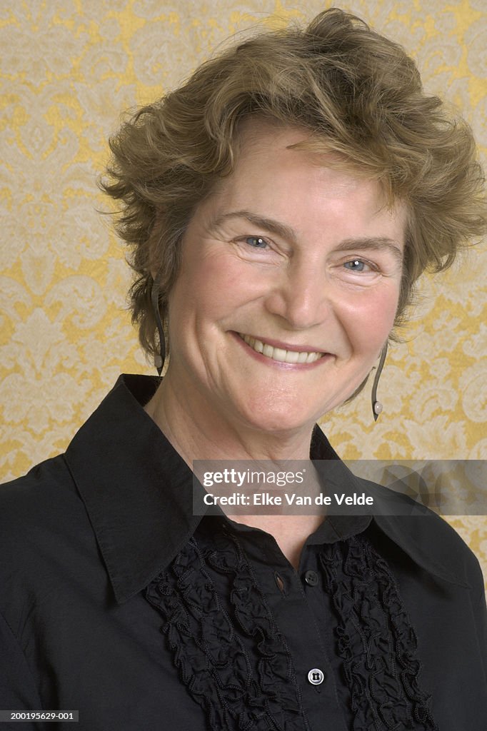 Portrait of senior woman smiling, close-up