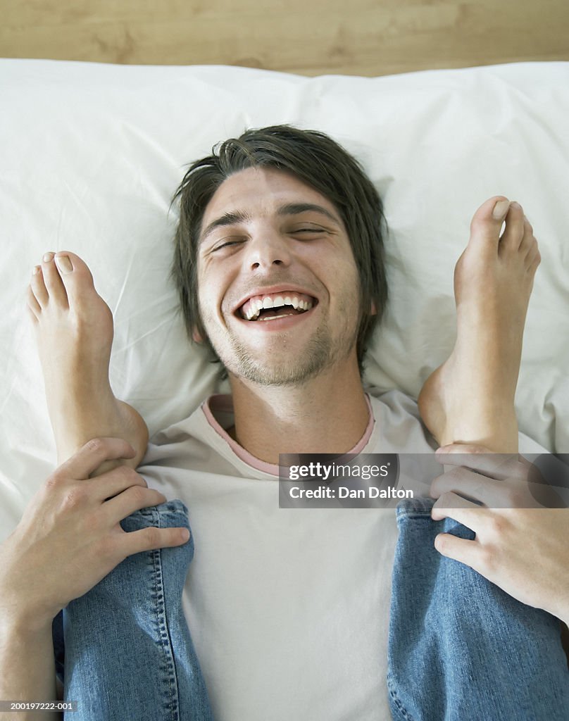 Couple Top To Toe Man Holding Womans Ankles Laughing Closeup High-Res ...