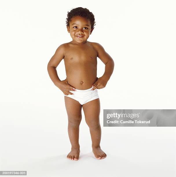 boy (2-4) standing in underwear, portrait - black slip stock-fotos und bilder