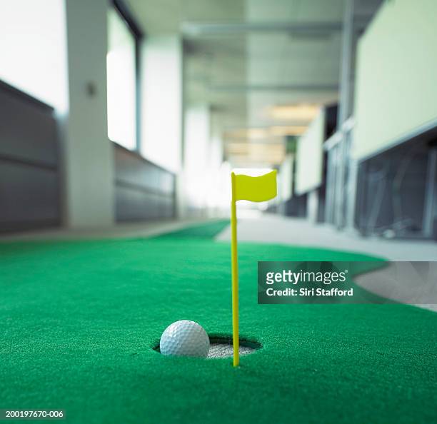 miniature golf in office, focus on hole - mini golf stock pictures, royalty-free photos & images