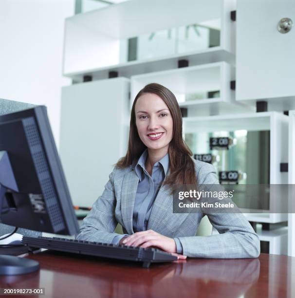 Girl Behind A Computer Young Woman Sitting Behind Desk With Computer Smiling Portrait High-Res ...